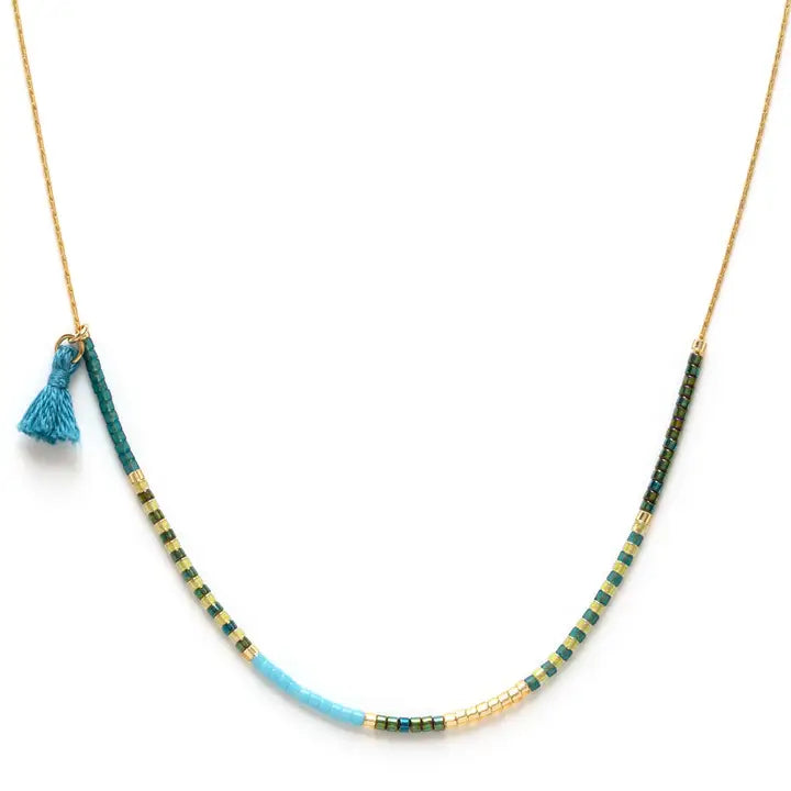 Necklace with blue tassel and multicolored beads on a white background