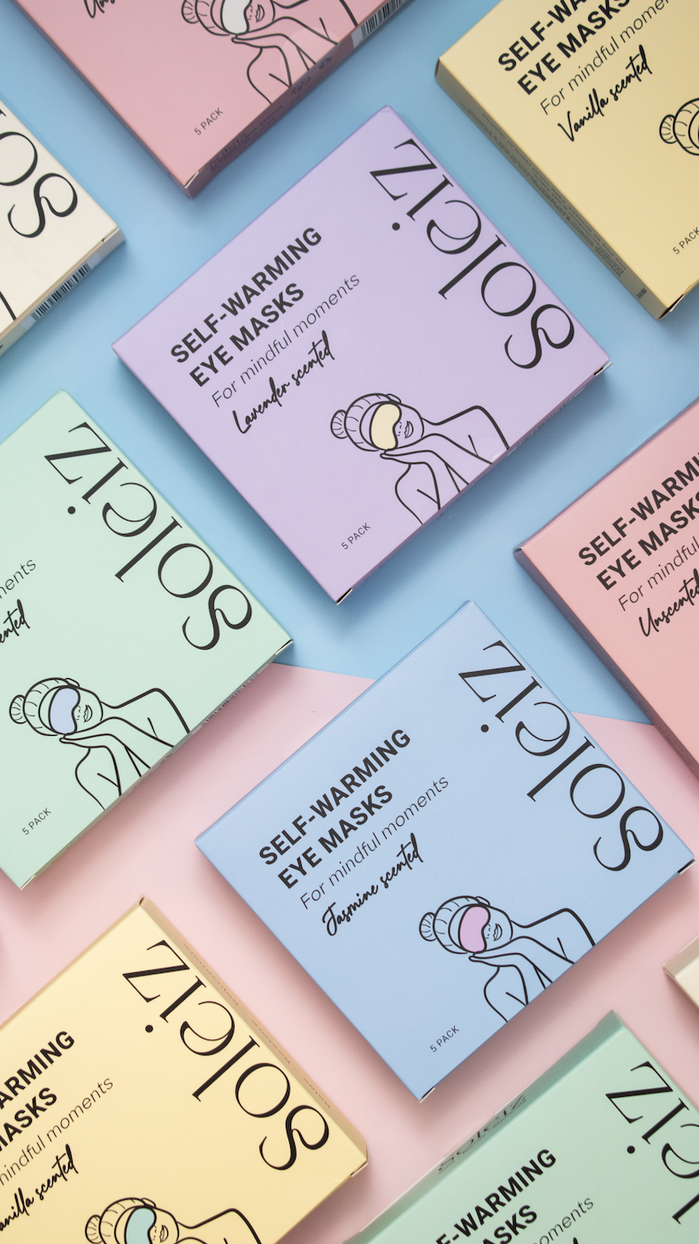 Collection of Soliz self-warming eye mask boxes on a colorful background Australia